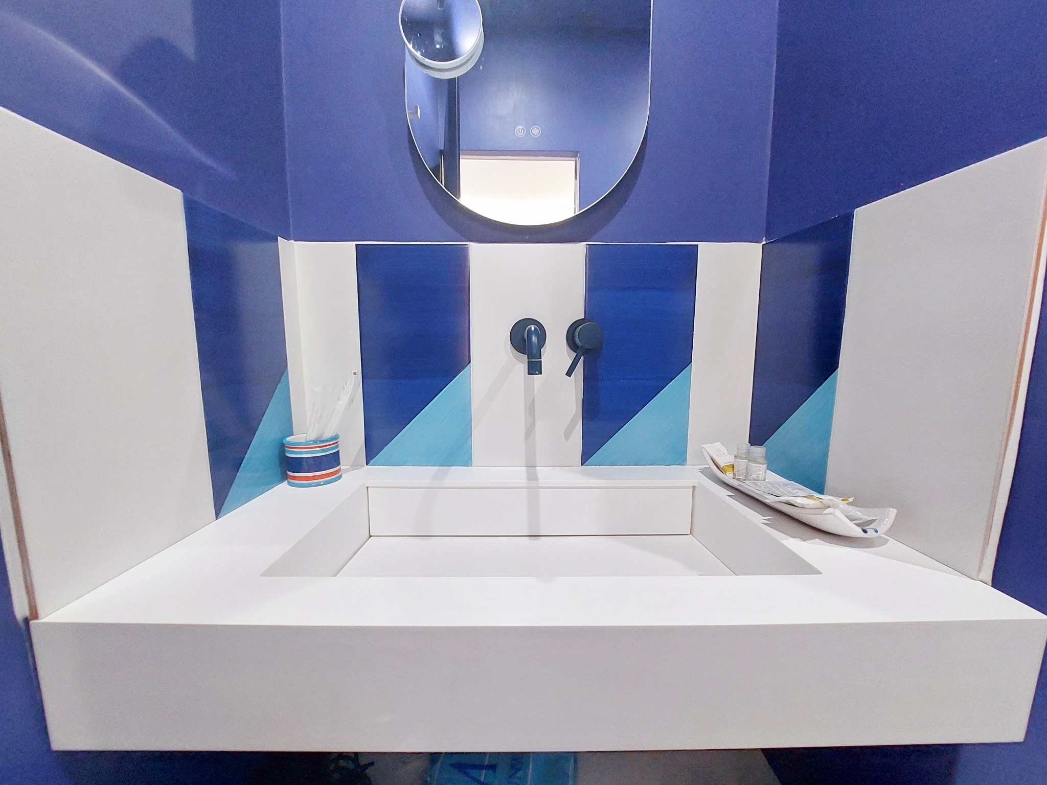 White sink with blue tiles
