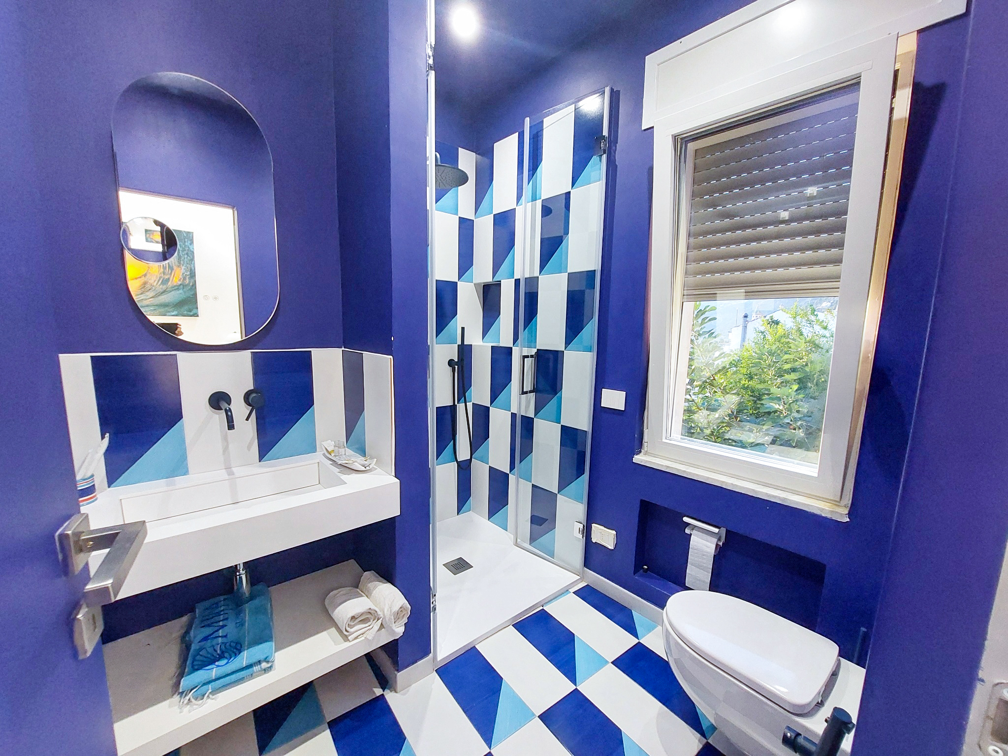 Blue bathroom with glass shower