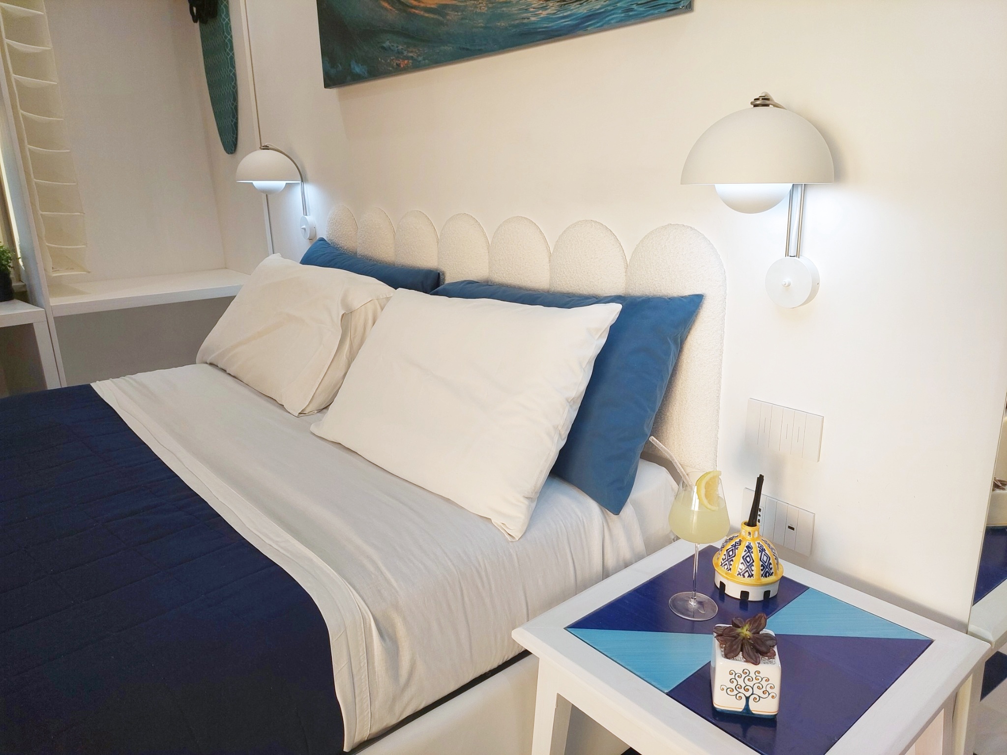 Double bed with ceramic bedside table