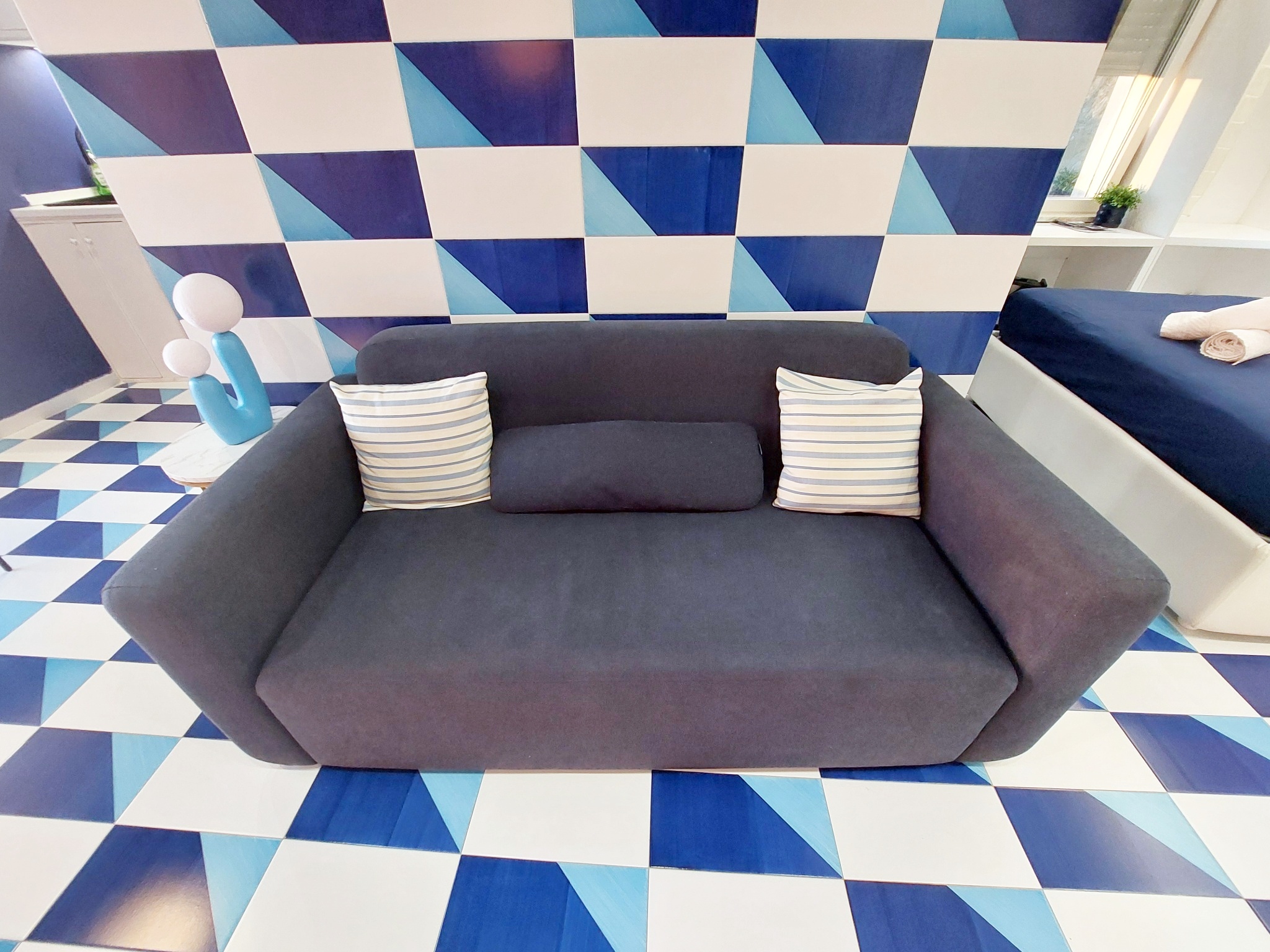 Sofa with blue geometric tiles